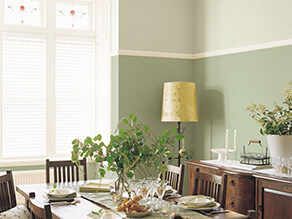 Dining room with a pop of green